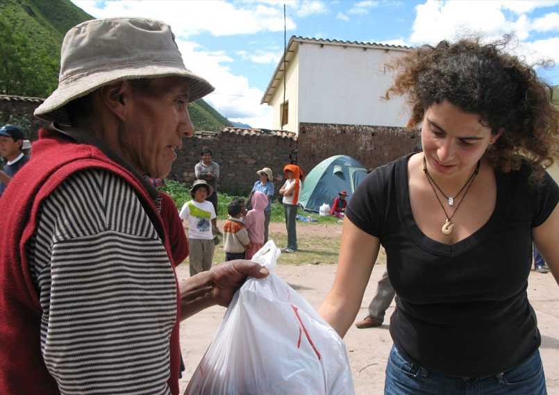 Man receiving food bag from Danièle